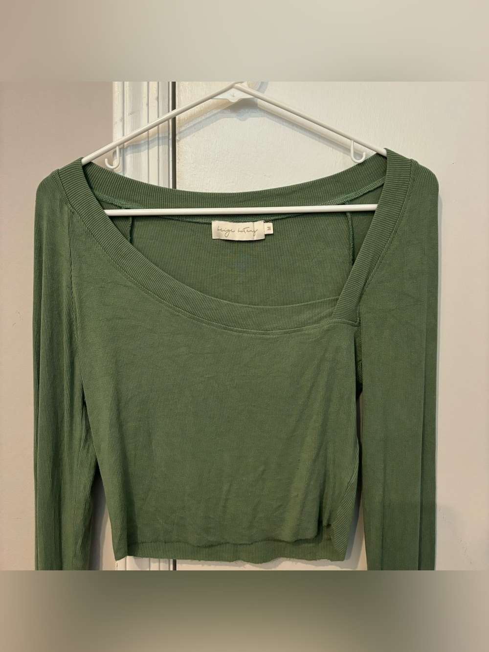 Green asymmetrical long-sleeve top